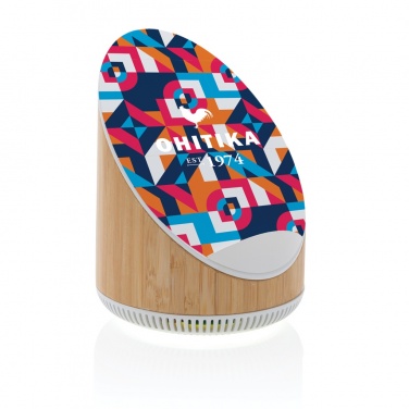 Logotrade meene foto: Ovate bambusest 5W kõlar koos 15W juhtmevaba laadijaga